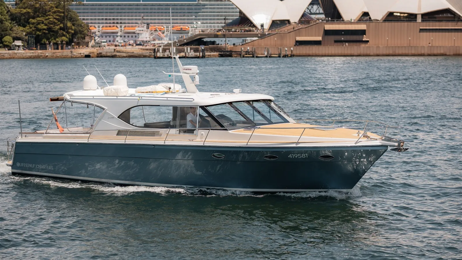 Felix, a 58ft Salthouse sports cruiser, on Sydney Harbour with the Opera House behind