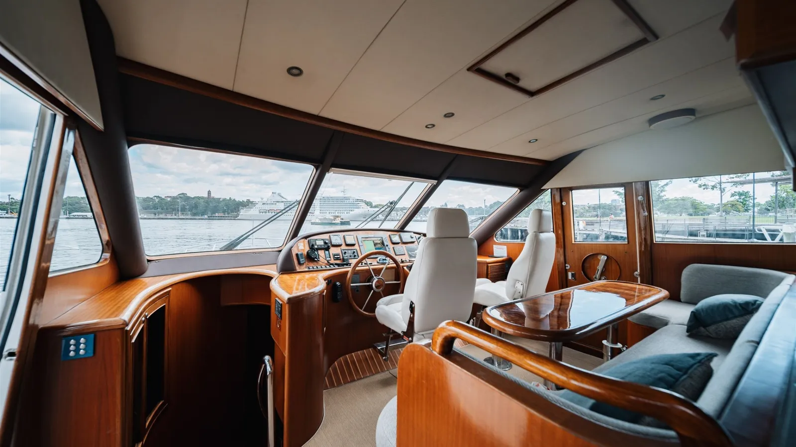 Enigma's lower helm and dinette with panoramic windows