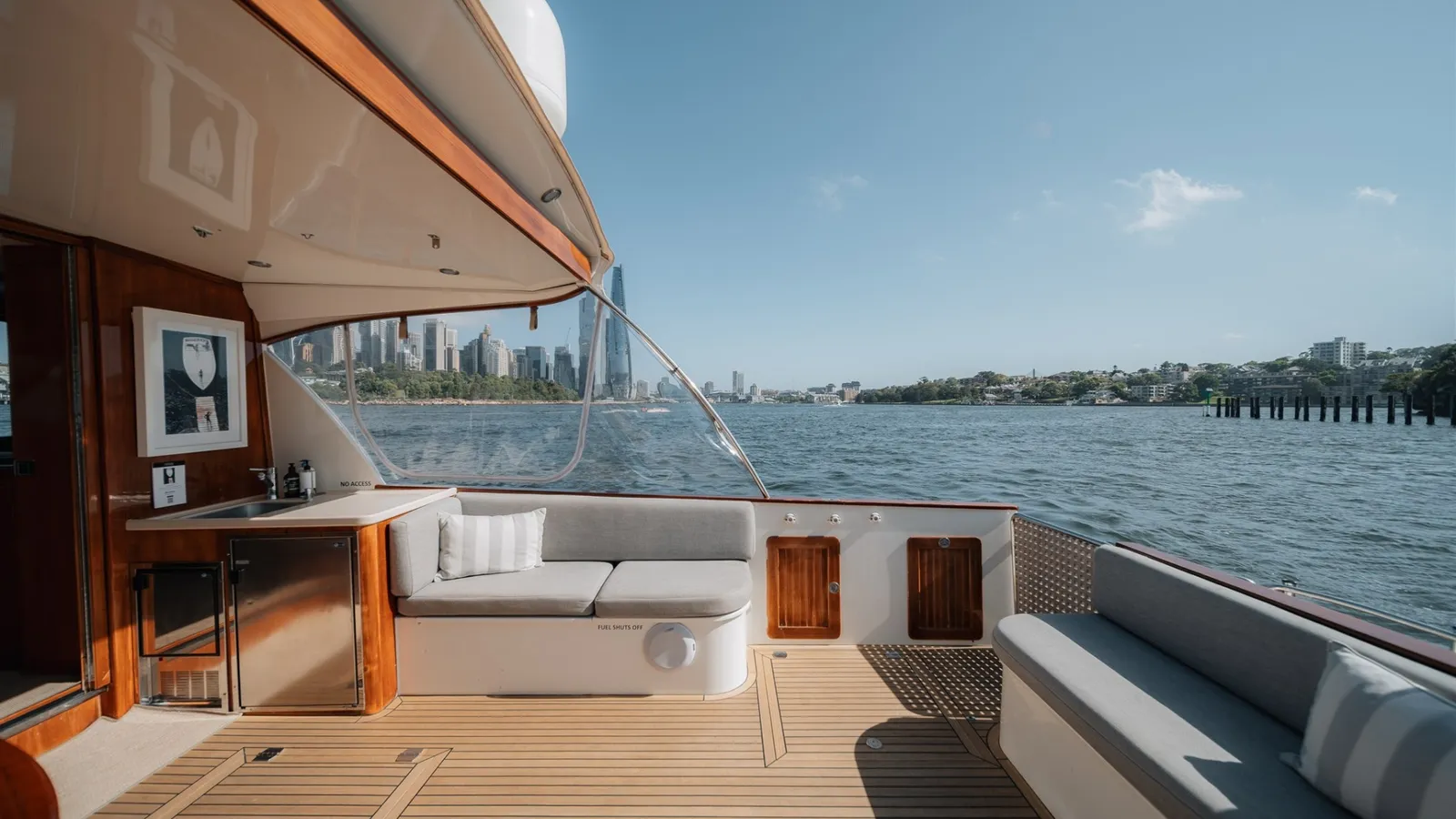 Felix's open cockpit with bar and lounge seating, looking out to the Sydney city skyline