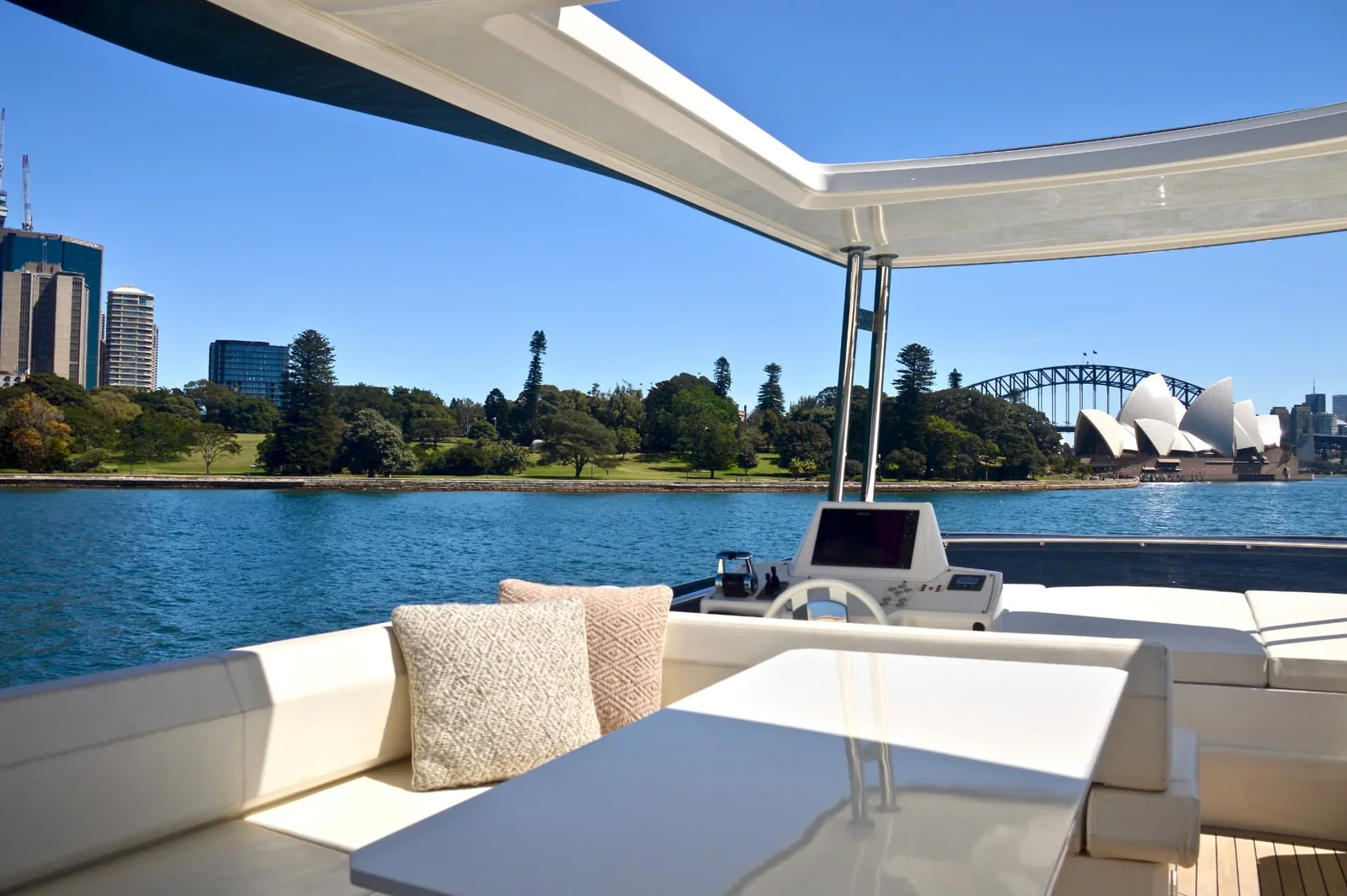 The Ribbon flybridge lounge and helm with views to the Opera House and Harbour Bridge