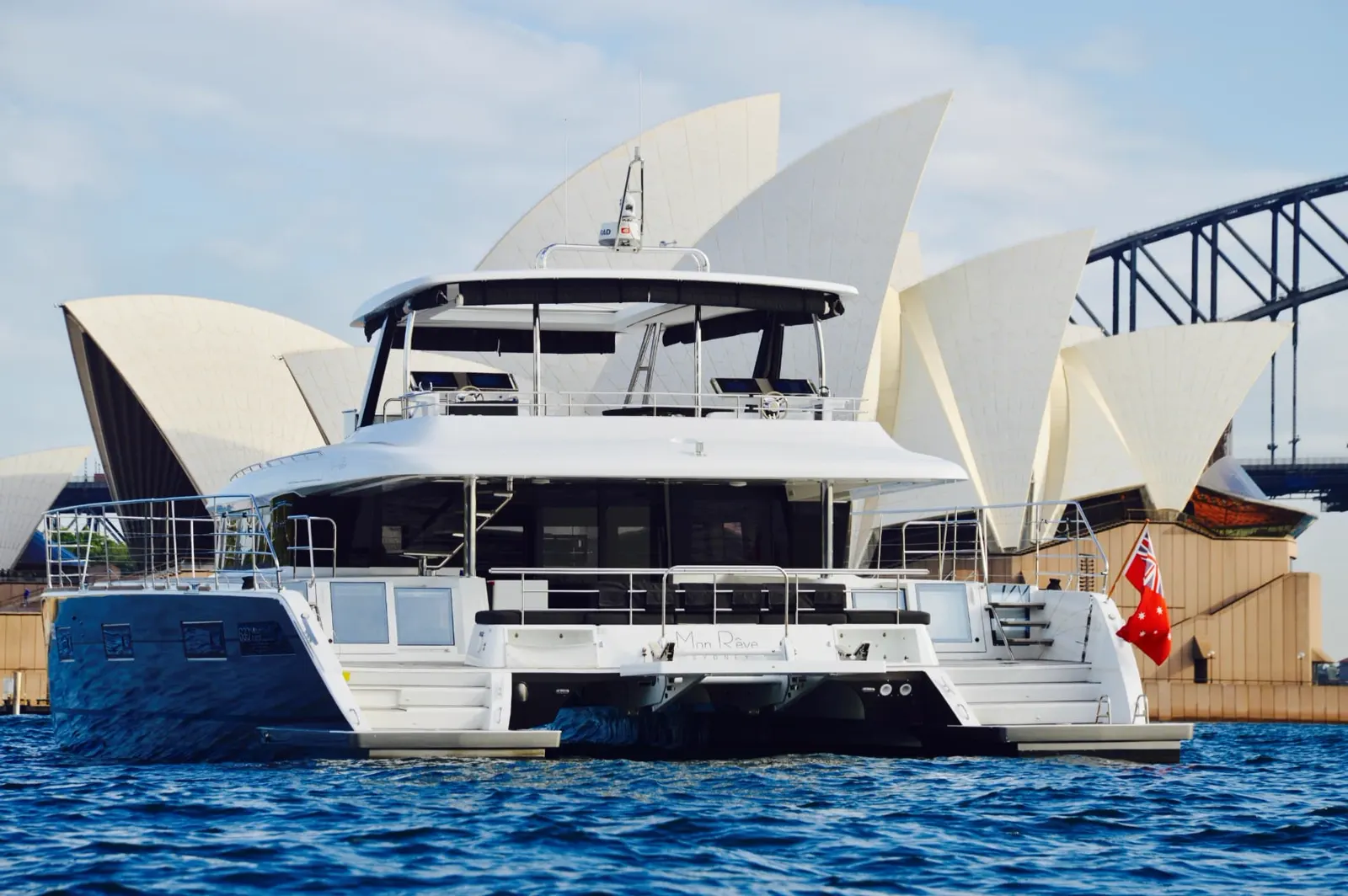 Mon Rêve, a Lagoon 630 motor yacht, on Sydney Harbour in front of the Sydney Opera House