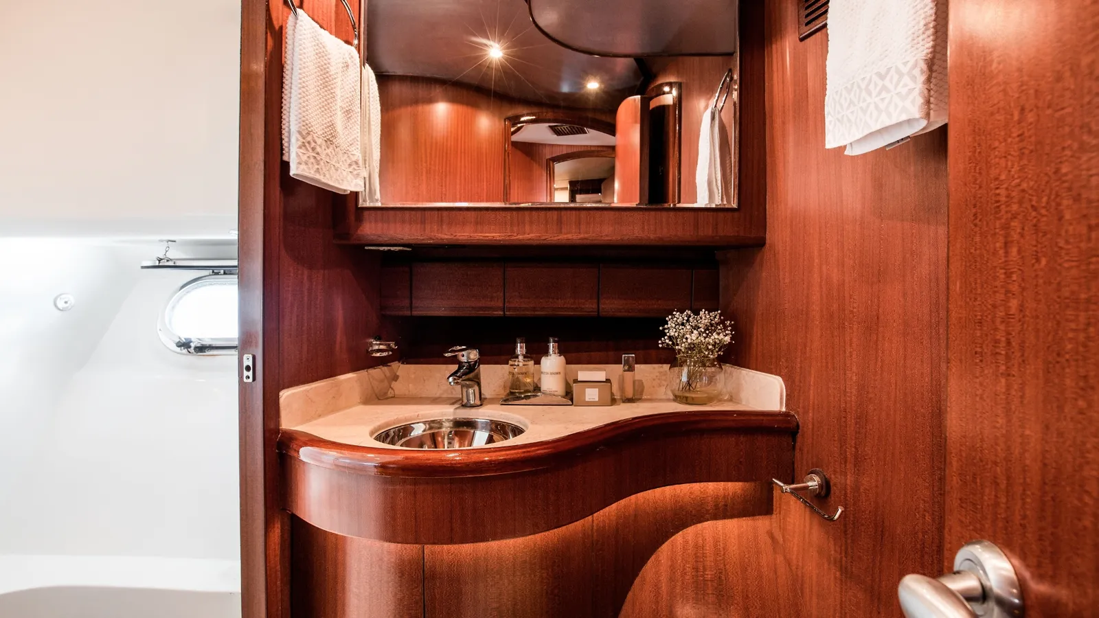 Enigma's bathroom with timber vanity and basin