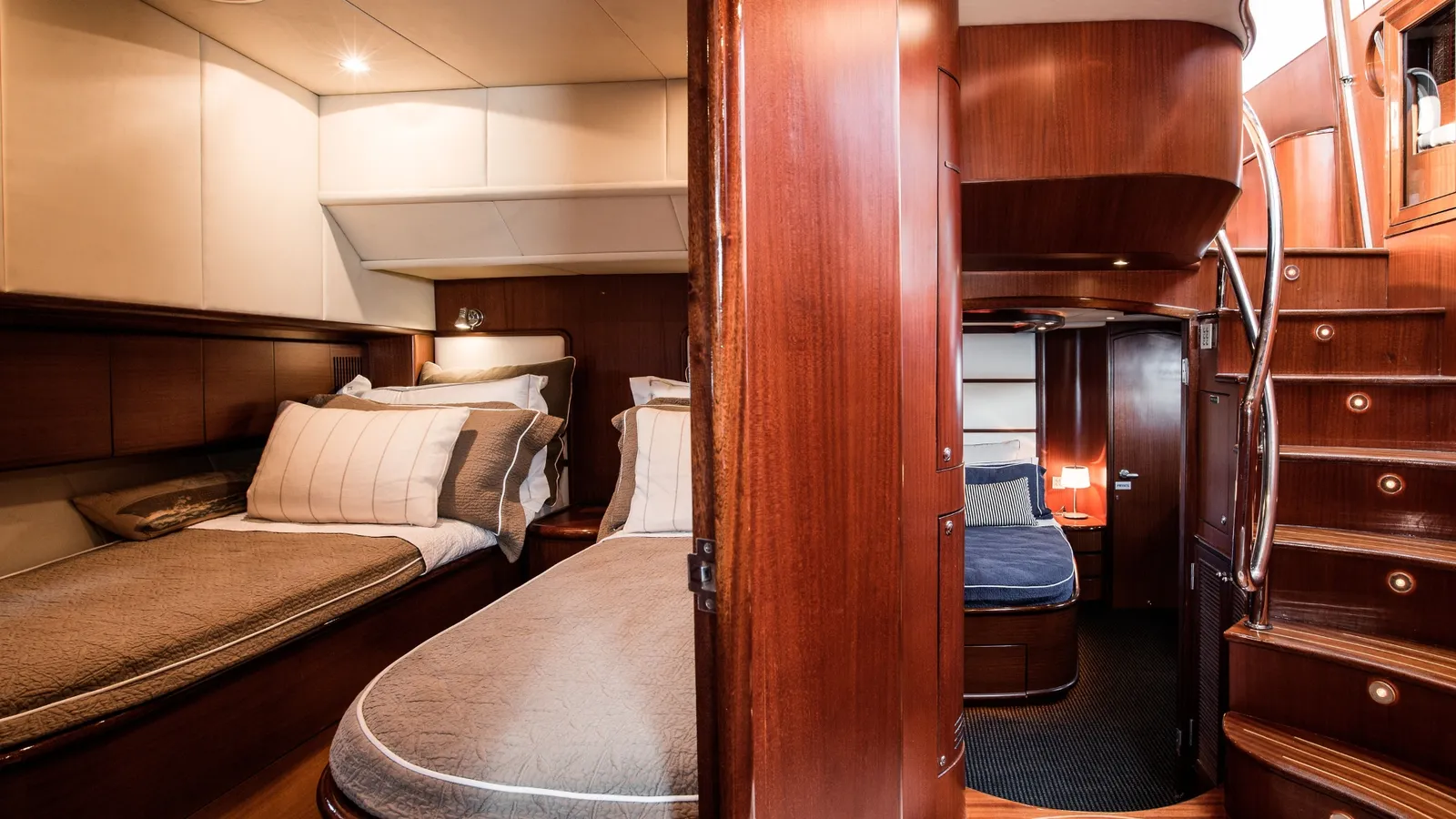 Enigma's guest cabins with timber panelling and twin beds