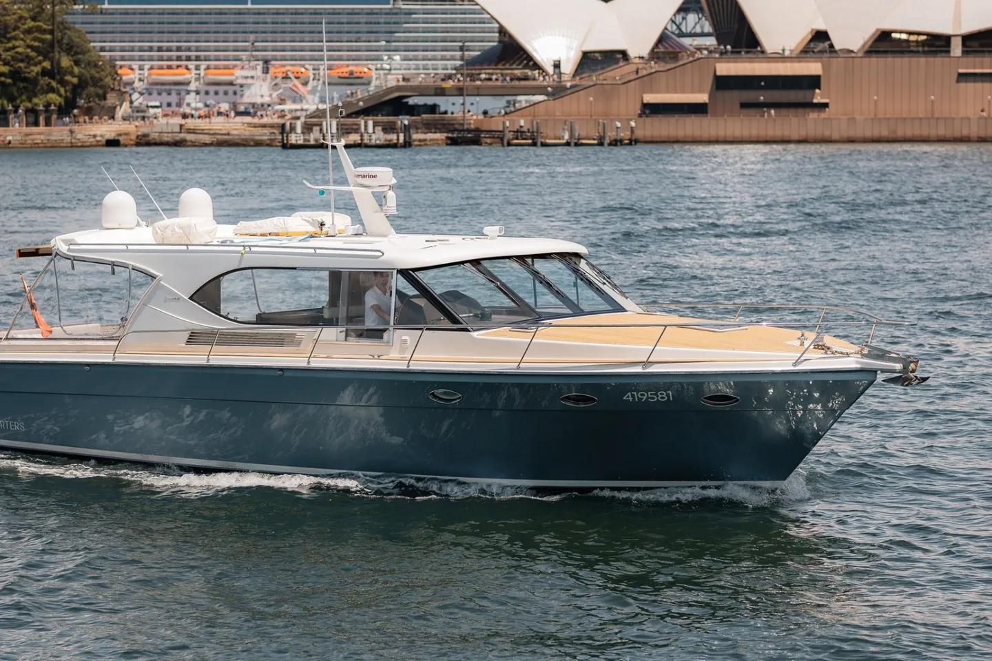Felix, a 58ft Salthouse sports cruiser, on Sydney Harbour with the Opera House behind