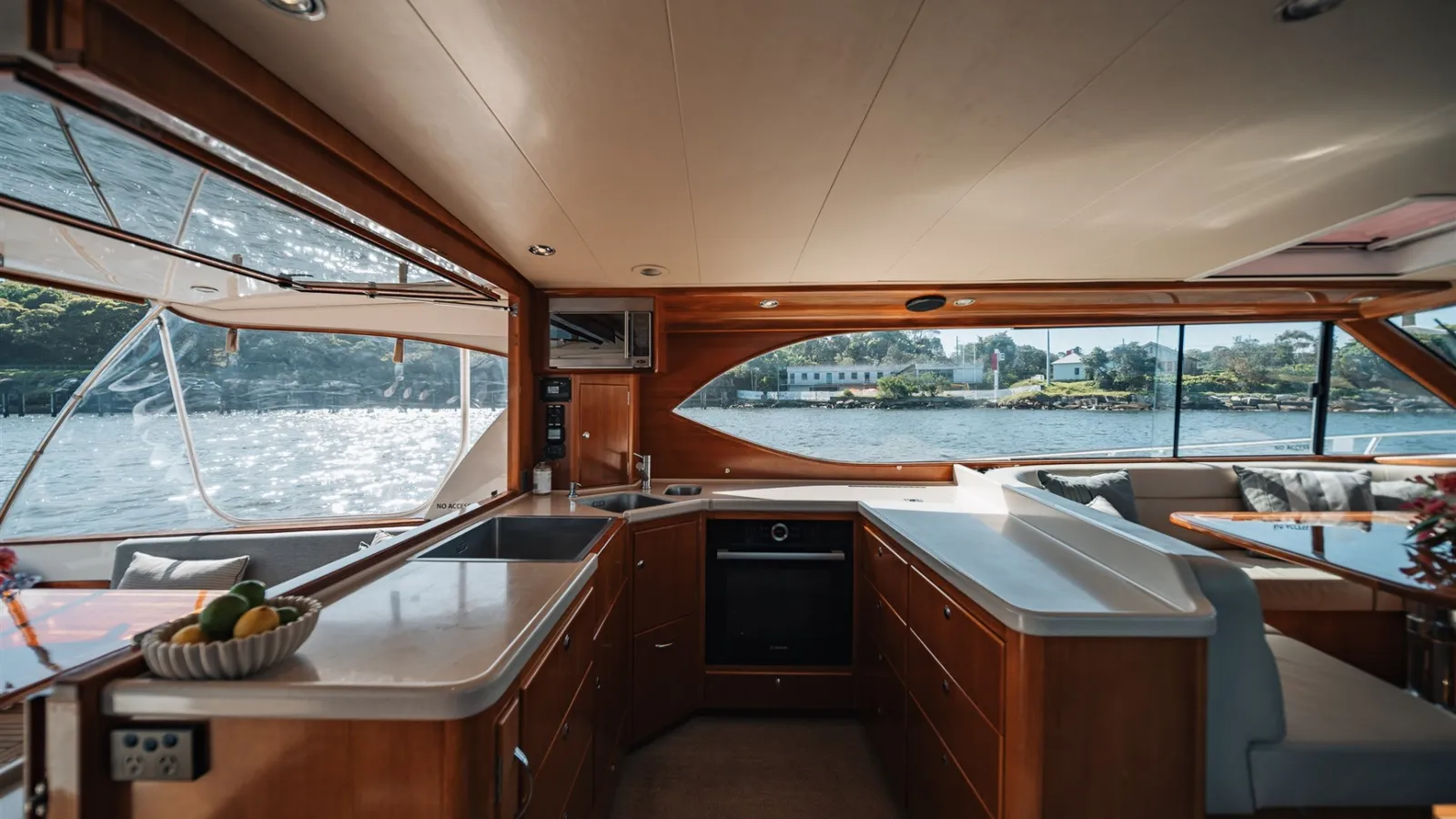 Felix's central galley and bar with harbour views through the saloon windows