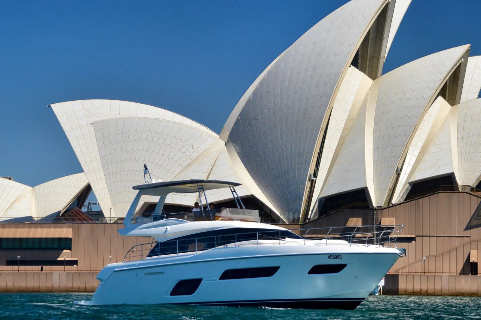 The Ribbon, a Ferretti 550 motor yacht, cruising past the Sydney Opera House