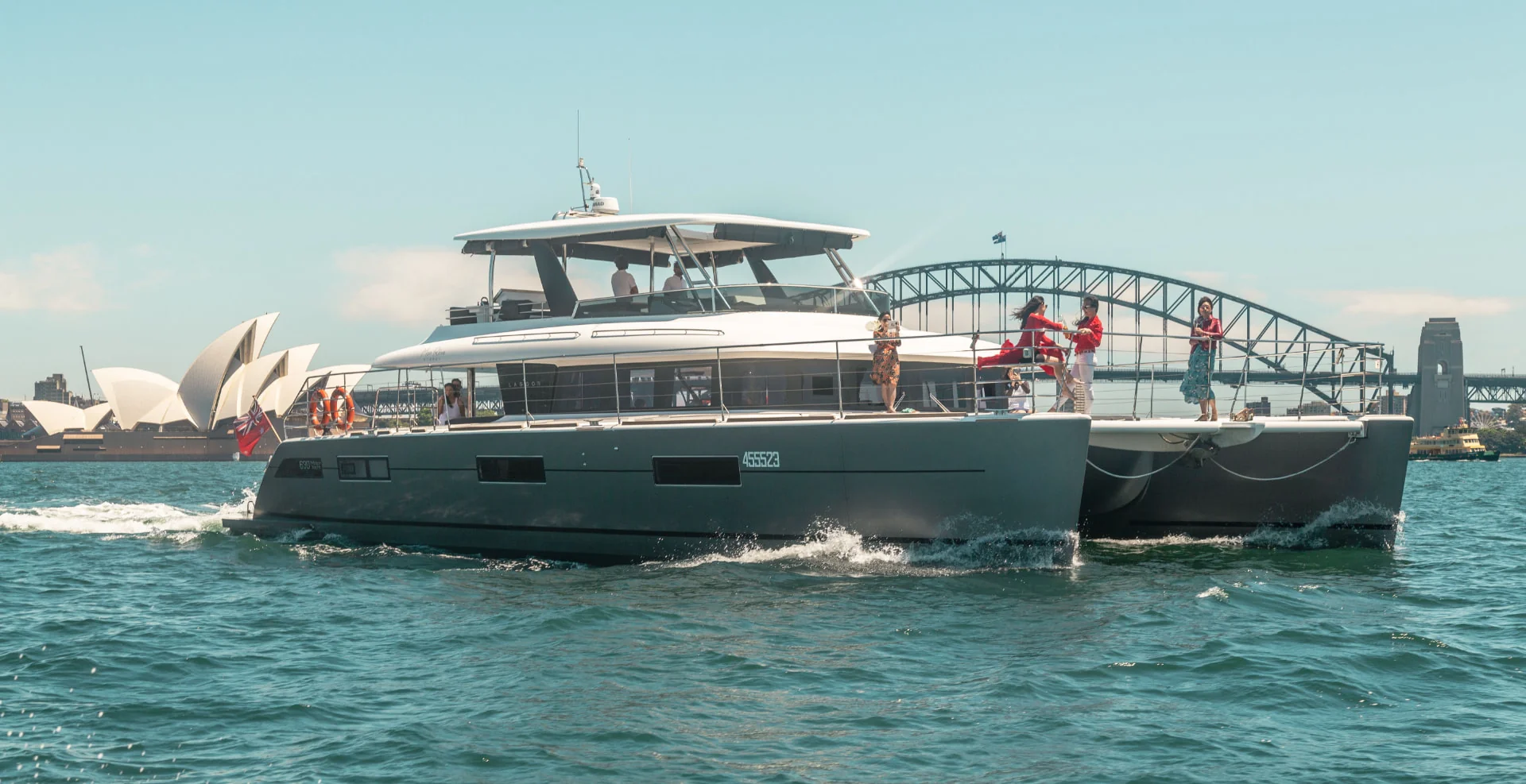 Mon Rêve, a Lagoon 630 luxury motor yacht, cruising on Sydney Harbour past the Opera House and Harbour Bridge